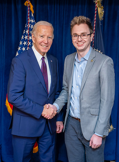 President Biden and Chris Frommann shake hands